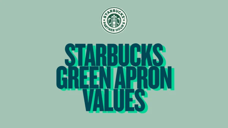 Barista proudly wearing Starbucks green apron, representing core values of warmth, connection, and community—discover what makes the culture special.